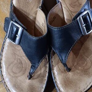Born black leather slip-on low wedge heel sandals w/silver buckle. Size 8 B/38